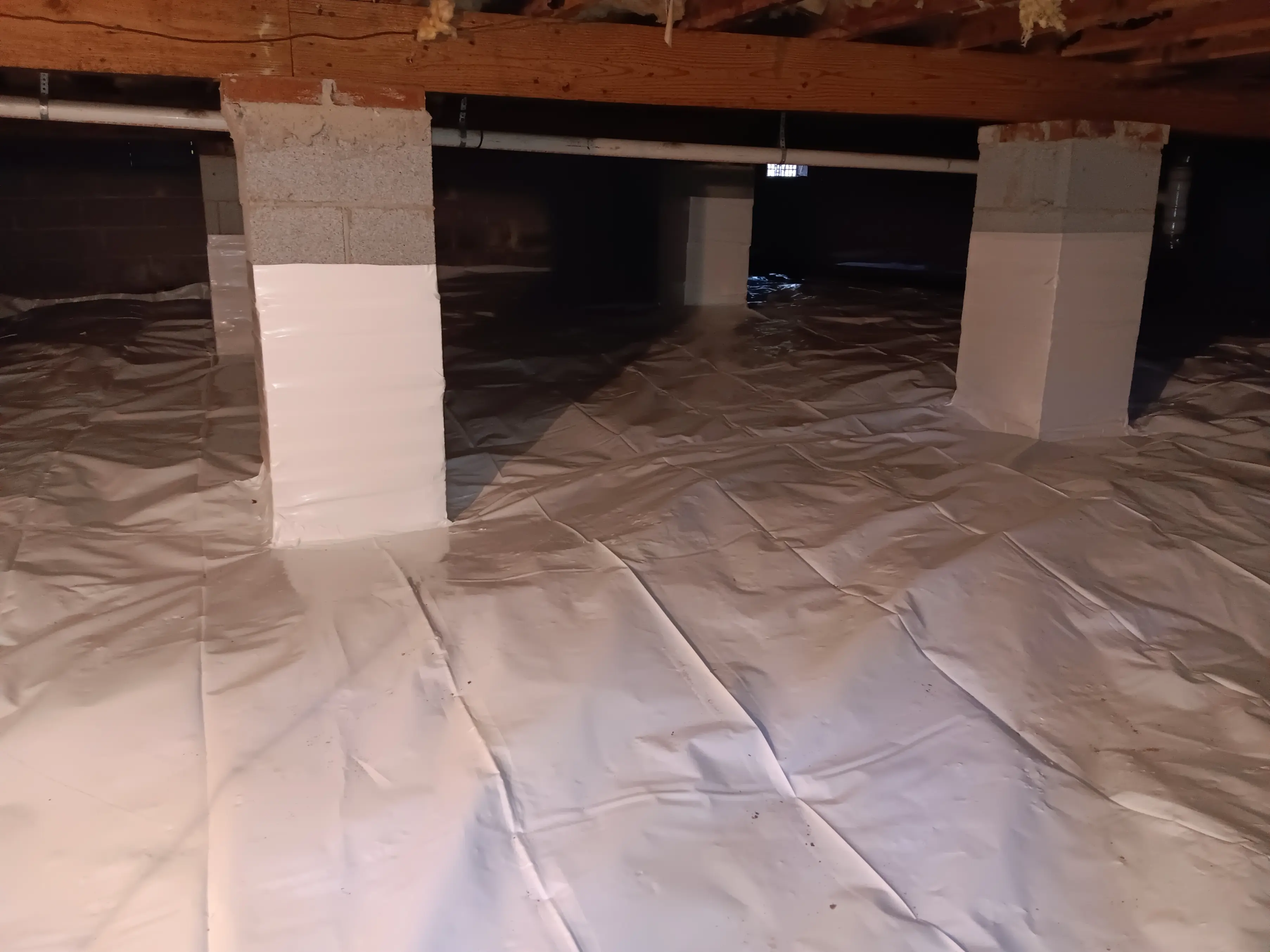 Crawl space waterproofing and encapsulation to block groundwater moisture